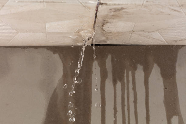 Professional Flood Damage Cleanup technician working in Highland, CA